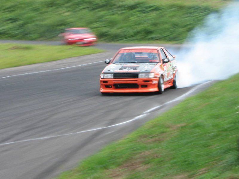 Stunt car driving on a course