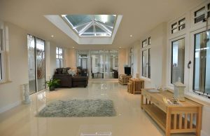 Modern with orangery with shiny floor and oak furniture