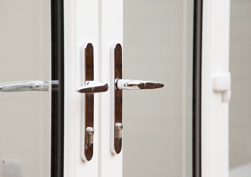 White french doors handle close up with double glazing in Penderford
