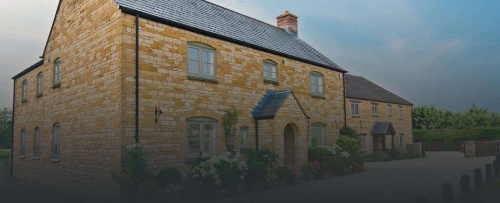 Grey flush sash windows on a yellow brick home in Sedgley